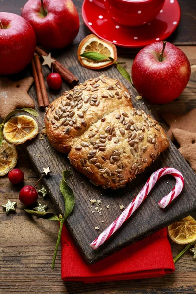 Christmas roll on wooden table. — Stock Photo, Image