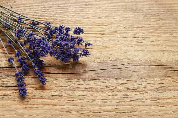 Bunch of lavender on wood — Stock Photo, Image