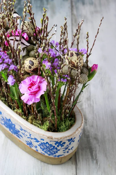 Floral arrangement with carnations and catkins — Stock Photo, Image