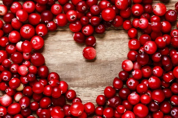 Cranberries fundo com forma de coração — Fotografia de Stock