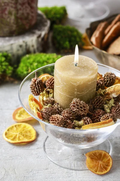 Candle holder decorated with cones and dried fruits. — Stock Photo, Image