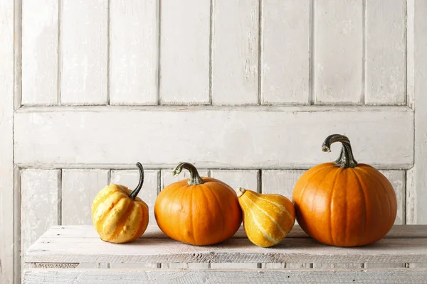 Pumpkins on wooden table — Stock Photo, Image