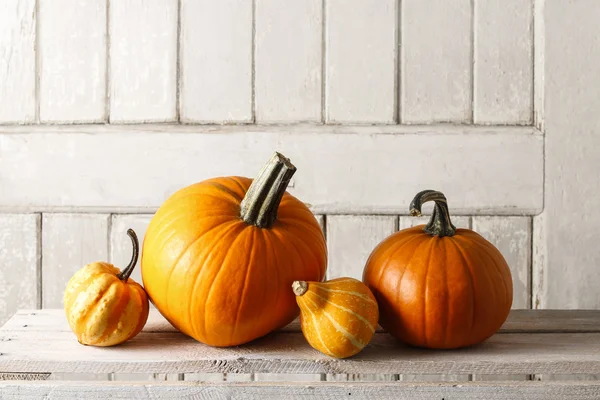 Pumpkins on wooden table — Stock Photo, Image