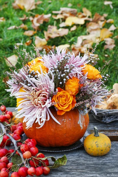 Bouquet of flowers in pumpkin — Stock Photo, Image