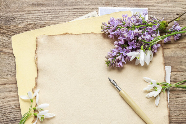 Lilacs and snowdrop anemone flowers (Anemone sylvestris) on vint