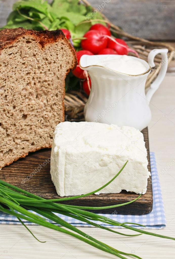 Block Of Cottage Cheese Loaf Of Bread And Jug Of Cream Stock