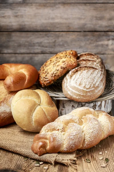 Breads and rolls on wood — Stock Photo, Image