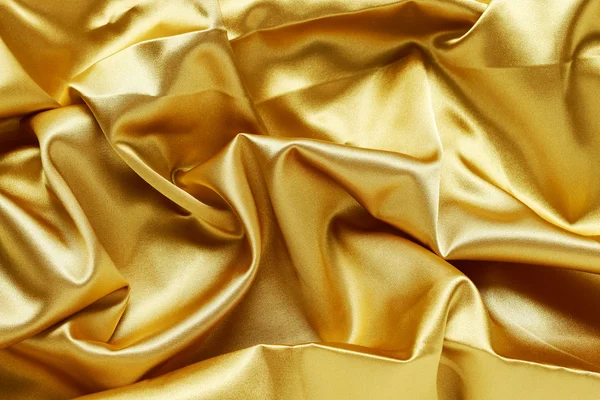 Golden fabric background — Stock Photo, Image