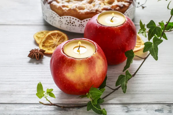 Candle in apple table decoration — Stock Photo, Image