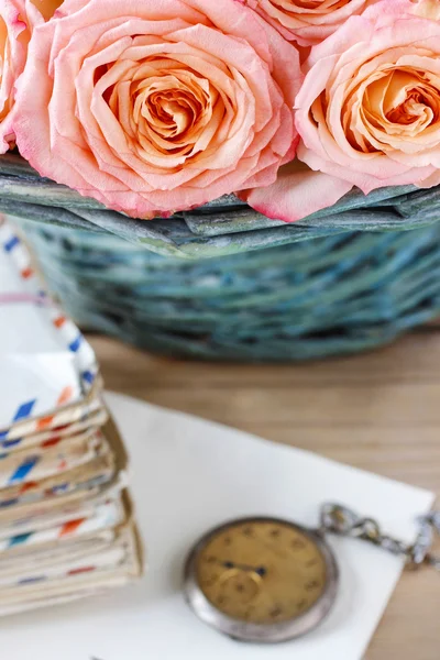 Pink roses in turquoise wicker basket Stock Image