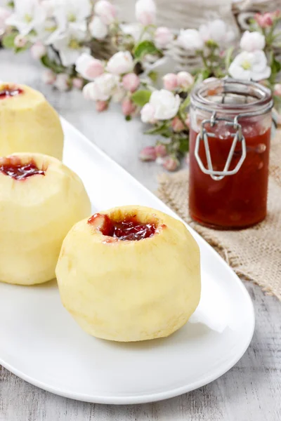 Apple stuffed with jam before baking — Stock Photo, Image