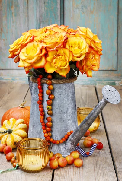 Bouquet of orange roses in silver watering can — Stock Photo, Image