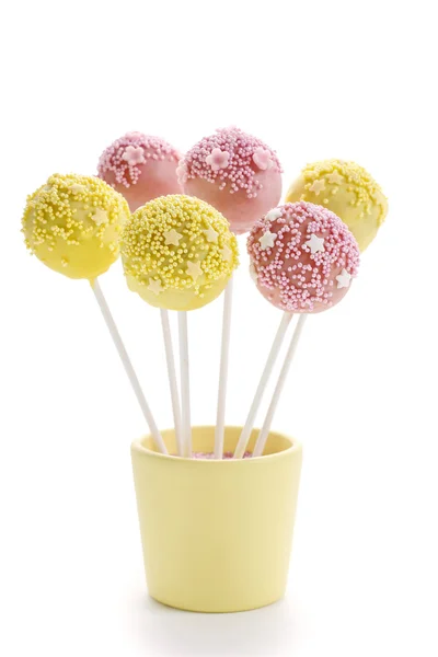 Pink and yellow cake pops isolated on white background — Stock Photo, Image