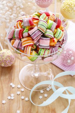 Children's party table: candies and cake pops clipart