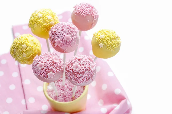 Pink and yellow cake pops — Stock Photo, Image