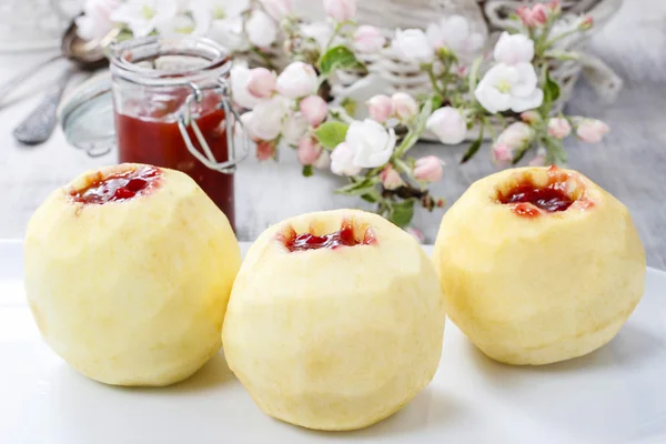 Apple stuffed with jam before baking — Stock Photo, Image