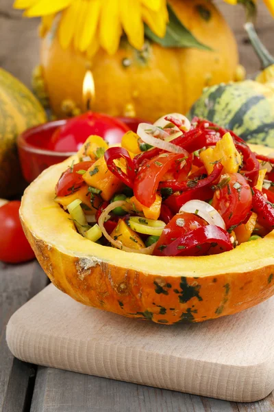 Vegetable salad served in pumpkin — Stock Photo, Image