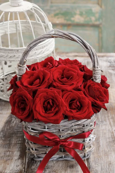 Bouquet of red roses in wicker basket