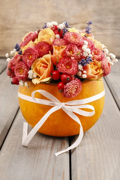 Bouquet of flowers in pumpkin — Stock Photo, Image