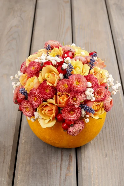 Bouquet of flowers in pumpkin — Stock Photo, Image