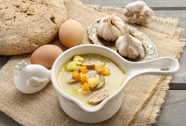 Portion of the sour rye soup made of soured rye flour and meat — Stock Photo, Image