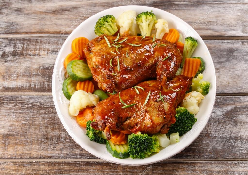 Roasted rabbit with vegetables — Stock Photo © agneskantaruk 60398889