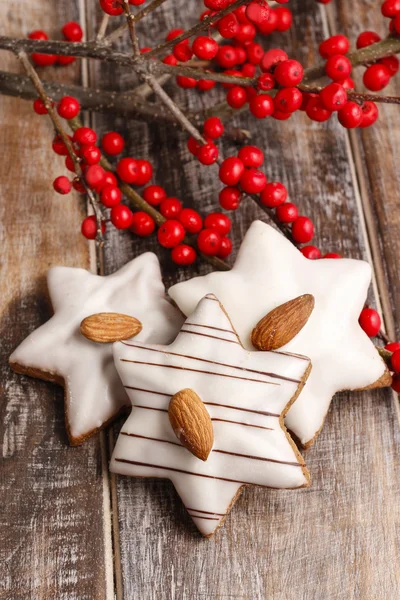 Gingerbread cookies in star shape decorated with almonds — Stock Photo, Image