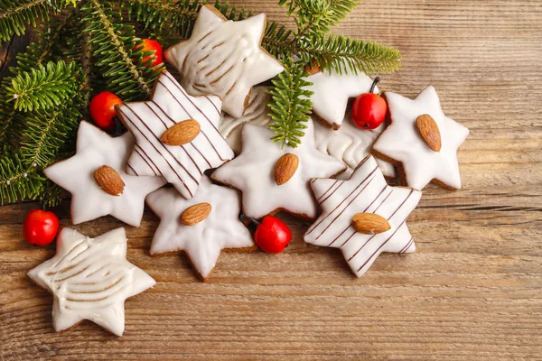 Gingerbread cookies in star shape decorated with almonds — Stock Photo, Image