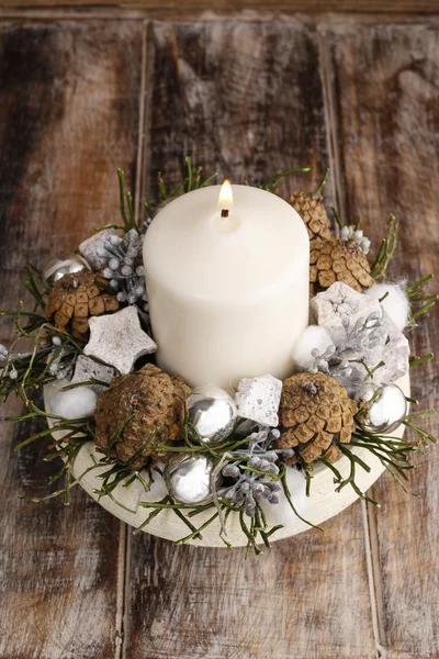 Christmas decoration with candle and cones — Stock Photo, Image