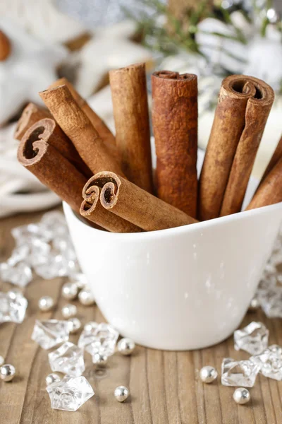 Cinnamon sticks in christmas setting — Stock Photo, Image