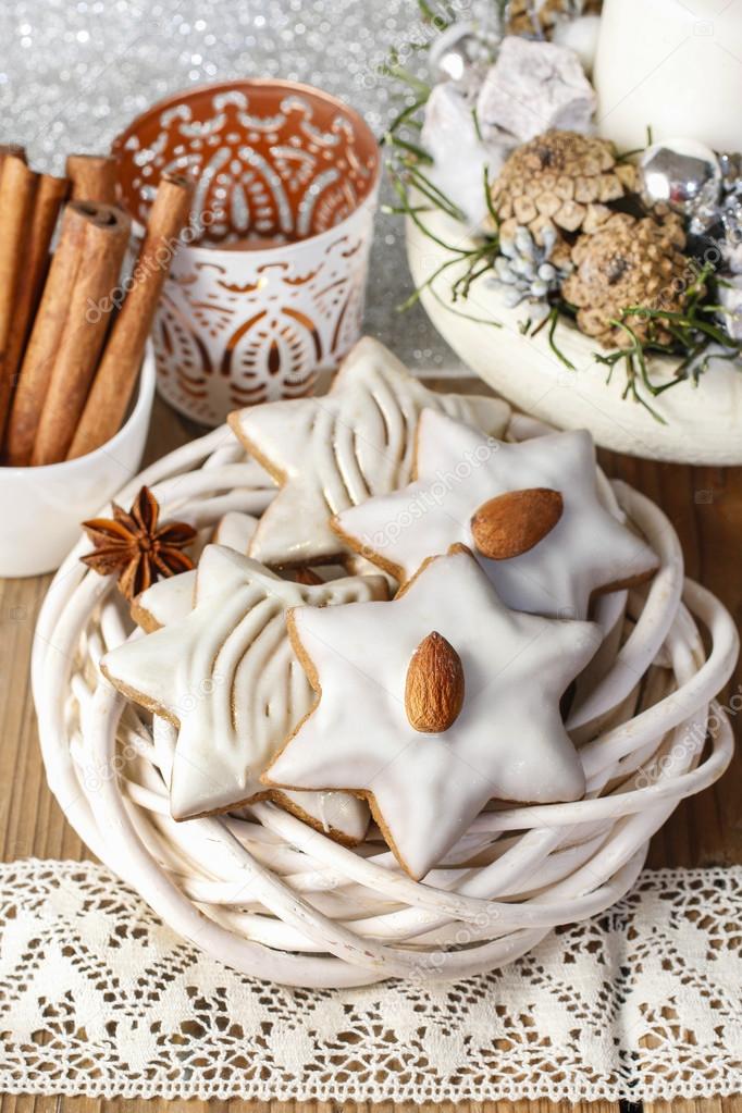 Gingerbread cookies in star shape decorated with almonds