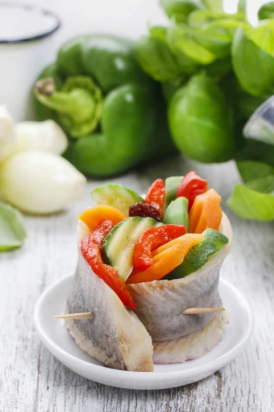 Pickled herring rolls with vegetables — Stock Photo, Image