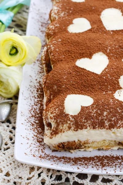 Tiramisu cake decorated with hearts — Stock Photo, Image