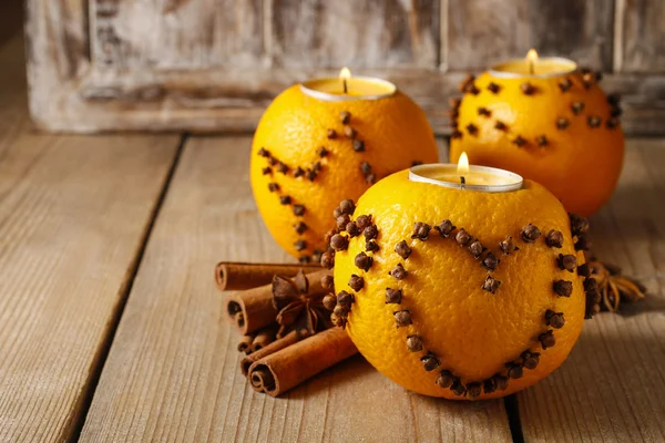 Orange pomander ball with candle, christmas decoration — Stock Photo, Image