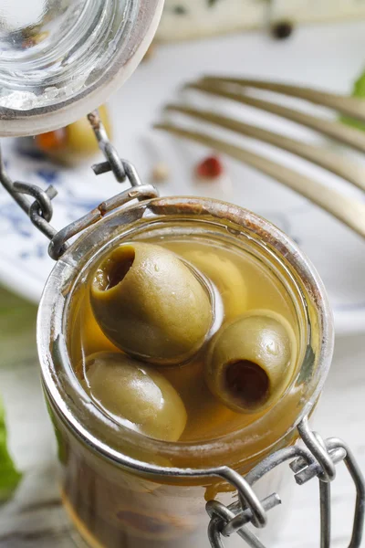 Green olives in glass jar — Stock Photo, Image