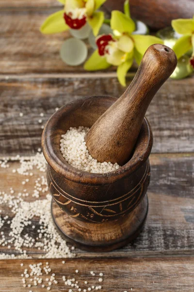 Sea salt in wooden mortar — Stock Photo, Image