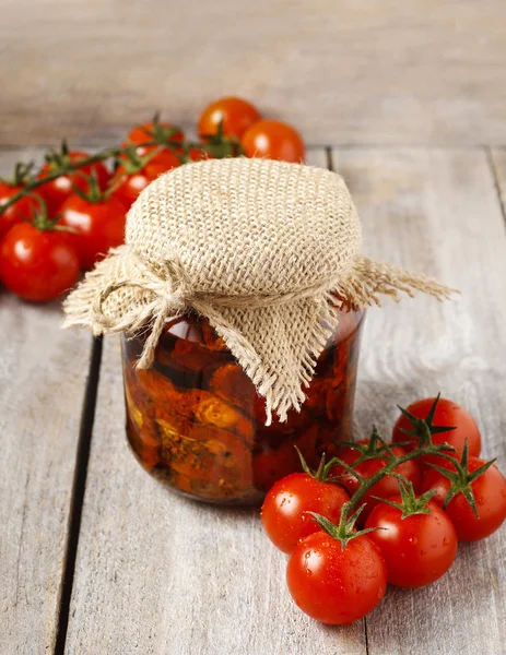 Glass jar of dried tomatoes, — Stock Photo, Image