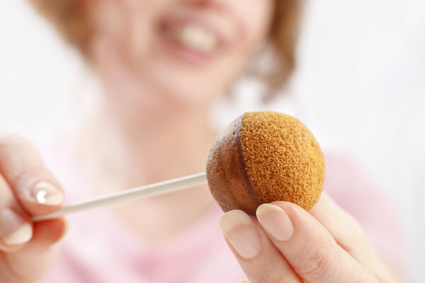 Woman making cake pops.