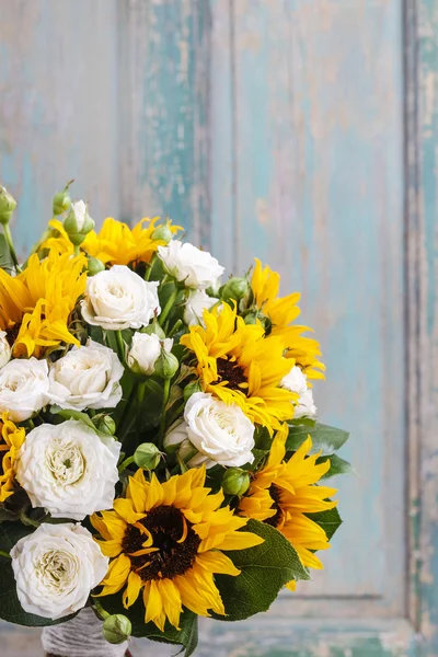 Bouquet of white roses and sunflowers