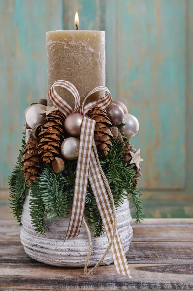 Christmas decoration with candle and cones — Stock Photo, Image