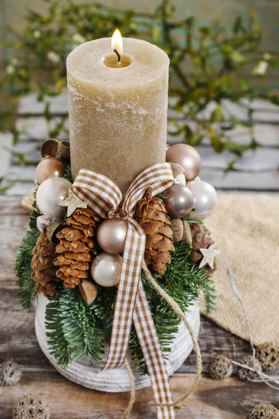 Christmas decoration with candle and cones — Stock Photo, Image