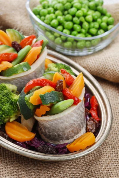 Pickled herring rolls with vegetables — Stock Photo, Image