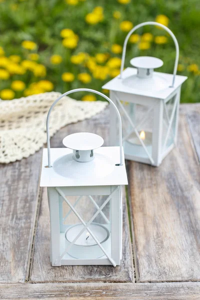 White iron lanterns on wooden table — Stock Photo, Image