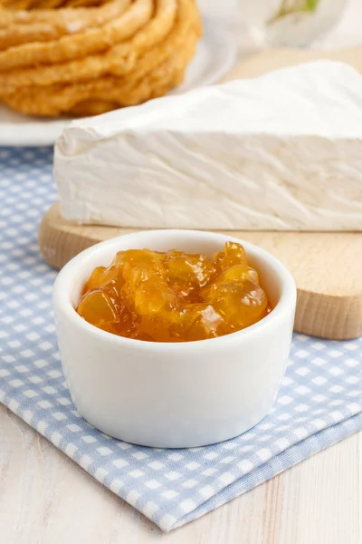 Churro donuts and bowl of honey — Stock Photo, Image