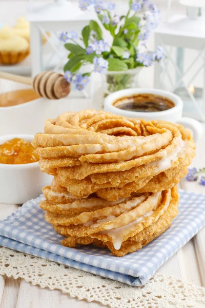 Churro donuts and bowl of honey — Stock Photo, Image