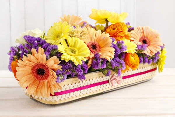 Table floral arrangement with gerbera flowers — Stock Photo, Image