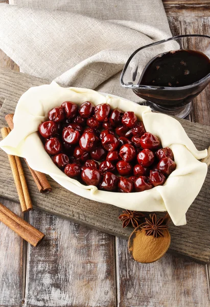 French puff pastry with cherries before baking — Stock Photo, Image