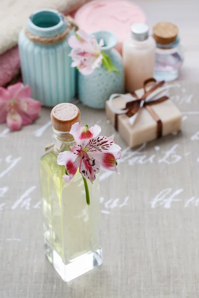 Bottle of essential oil and spa cosmetics — Stock Photo, Image