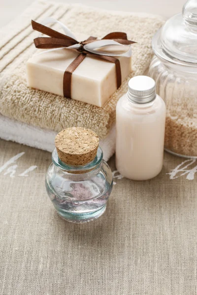 Bar of handmade soap, bottle of essential oil and bottle of liqu — Stock Photo, Image