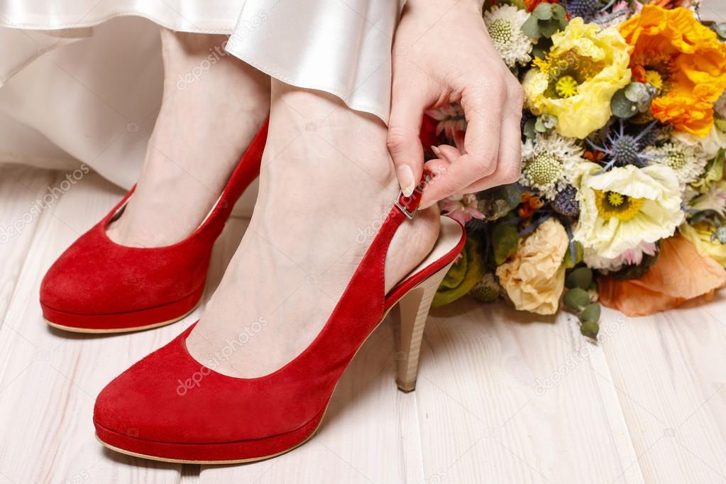 Bride in red shoes